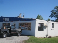Roof damage to a business in the Phelan community ~ 665K